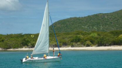 A group of people sailing on a boat.